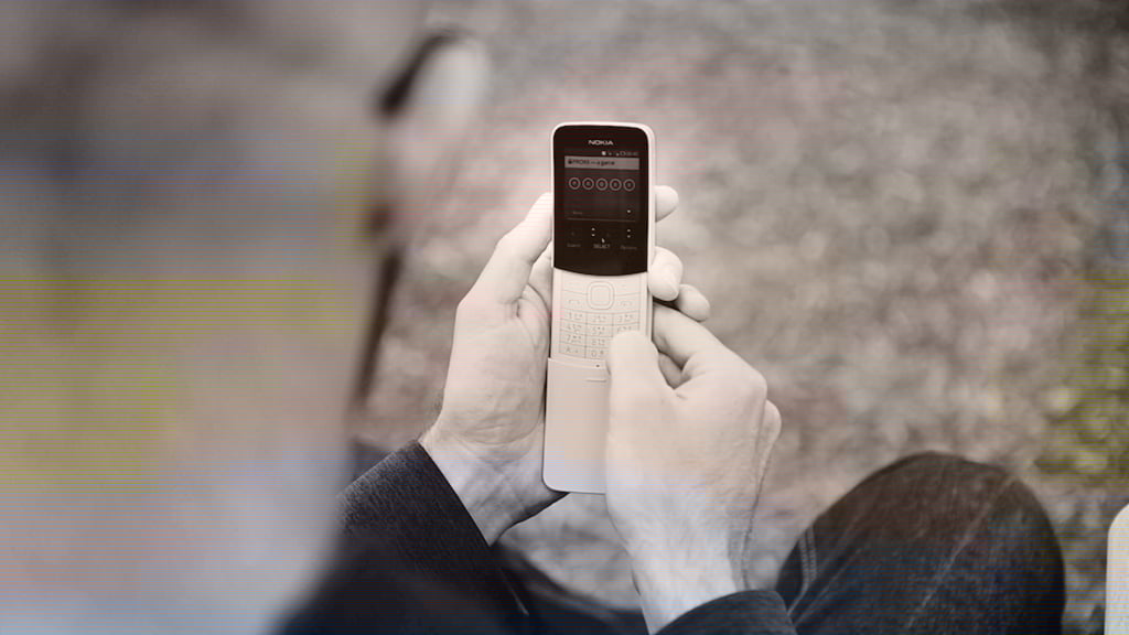 A picture of Paul playing PROXX on the Nokia 8110
